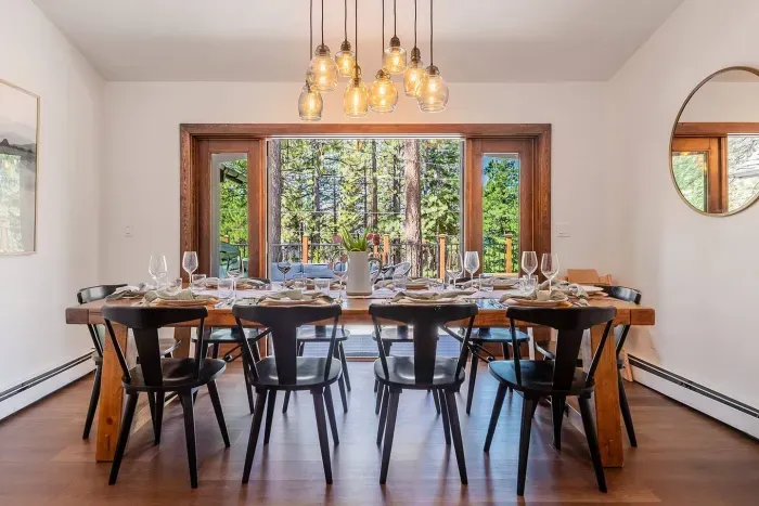 The dining room is just off the kitchen and has French doors that open out onto the deck. 