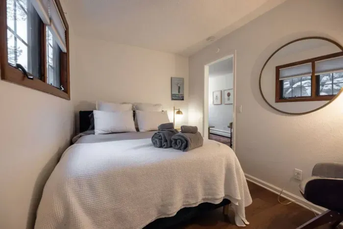 Another angle of bedroom #7, which is in the mother-in-law unit. You'll have your own bathroom, small living room and kitchenette if staying in this area. It is the only bedroom located on the first level of the home. 