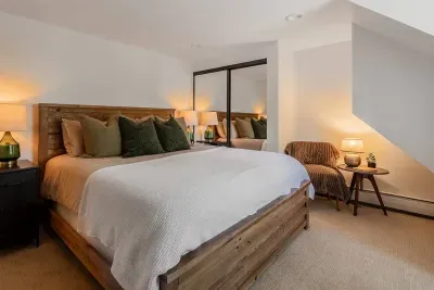 Here is bedroom #2, which features a king-size bed, a little seating area, and a work-from-home desk.
