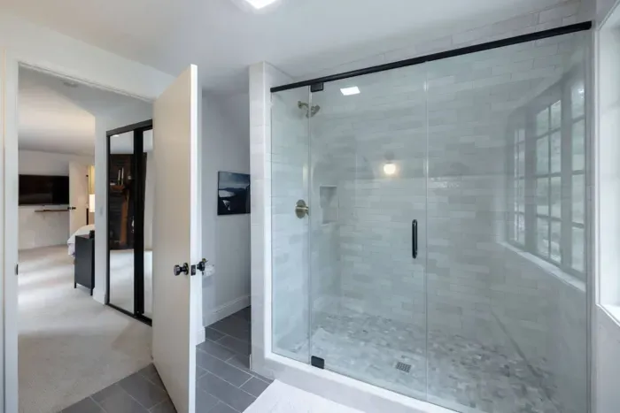 Recently remodeled full-size shower in the primary bathroom.