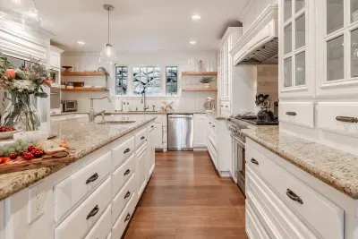 Our chef-style kitchen features TWO dishwashers, a full-size Thermador range, and three sinks!