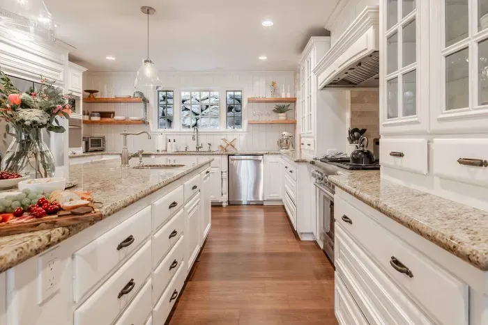 Our chef-style kitchen features TWO dishwashers, a full-size Thermador range, and three sinks!