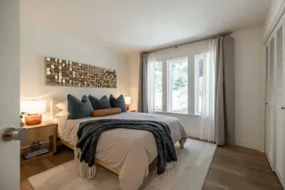 The second bedroom is outfitted with a comfortable queen bed, crisp cotton sheets and blackout shades for the mornings you may want to sleep in-just don't miss first chair!