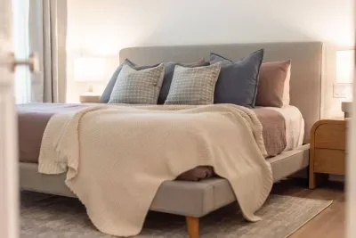 The primary bedroom has a brand new king sized bed, comfortable pillows, and  linen sheets for the perfect nights sleep after a day on the slopes