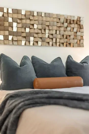 The second bedroom features a queen sized bed, comfortable bedding, and cozy pillows. 