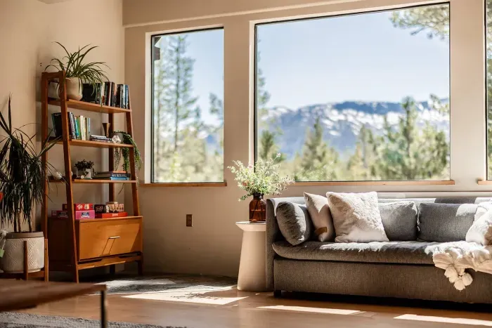 Our living room has the best views of the mountain range. You'll be able to enjoy the sunsets or watch the snow falling over the mountains.