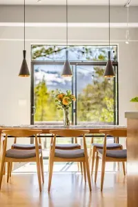 Our dining table features enough room for your entire group plus stunning views of the mountains and forest.