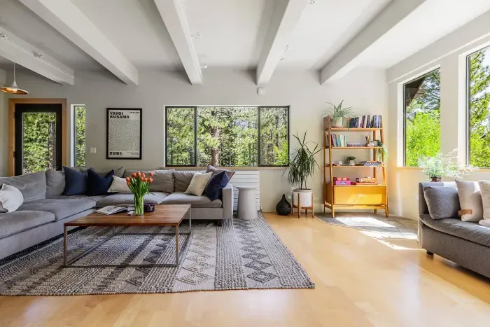 Our living room is downstairs and has amazing mountain and forest views. The extra large sectional is perfect for curling up with a great book, enjoying a show on our new 75" flatscreen television, or simply catching up with each other.