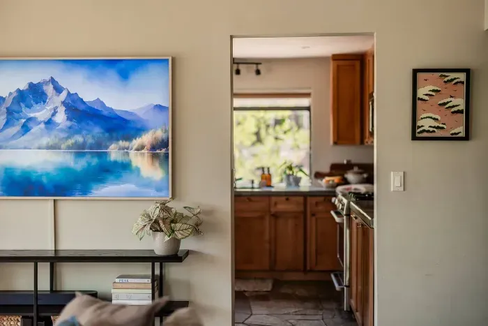 The view from the living room looking into the kitchen. We've just installed a 75" CanvasTV and have plenty of games and books available for your stay. Looking for a specific game or book? Just ask-we may be able to source it before your stay! 