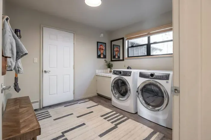 Our laundry room is just off of the garage and has high efficiency washer & dryer, utility sink, and storage space. We provide laundry detergent and plenty of cleaning products. 
