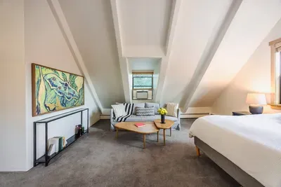 The primary suite at Echo View Chalet features a king-sized bed, seating area with trundle (extra sleeping space for our littlest guests) and 65" television. During the warmer phones, keep cool with a discreet window unit AC.

@dirtandglass