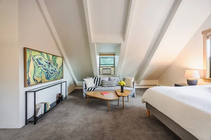 The primary suite at Echo View Chalet features a king-sized bed, seating area with trundle (extra sleeping space for our littlest guests) and 65" television. During the warmer phones, keep cool with a discreet window unit AC.

@dirtandglass