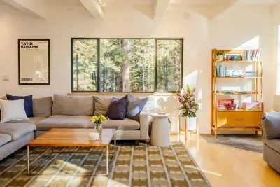 Our living room is downstairs and has amazing mountain and forest views. The extra large sectional is perfect for curling up with a great book, enjoying a show on our new 75" flatscreen television, or simply catching up with each other.

@pamcakes