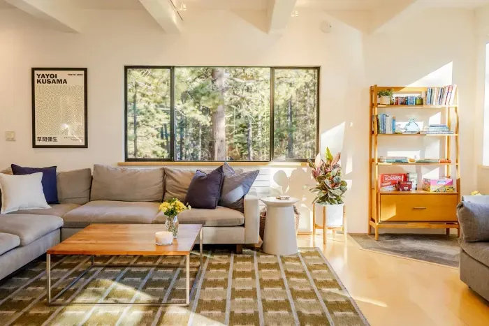 Our living room is downstairs and has amazing mountain and forest views. The extra large sectional is perfect for curling up with a great book, enjoying a show on our new 75" flatscreen television, or simply catching up with each other.

@pamcakes