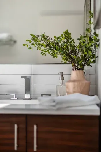 Our spa like bathroom with double vanity sinks located ensuite of the upstairs primary bedroom.