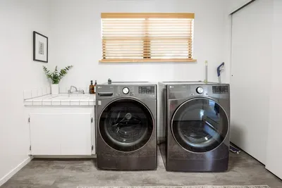 Our laundry room is just off of the garage and has high efficiency washer & dryer, utility sink, and storage space. We provide laundry detergent and plenty of cleaning products.