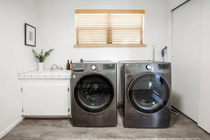 Our laundry room is just off of the garage and has high efficiency washer & dryer, utility sink, and storage space. We provide laundry detergent and plenty of cleaning products.