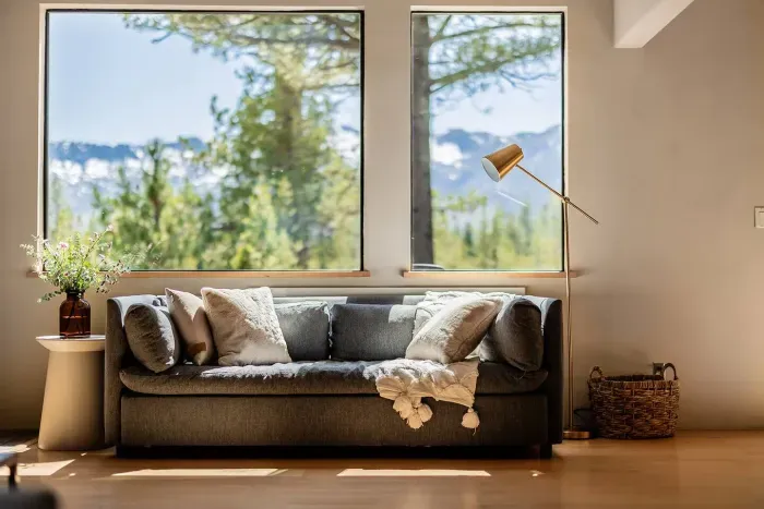 Another cozy seating area in our open concept living room, with great natural light anytime of year. You'll love watching the snow fall from these windows in winter. 