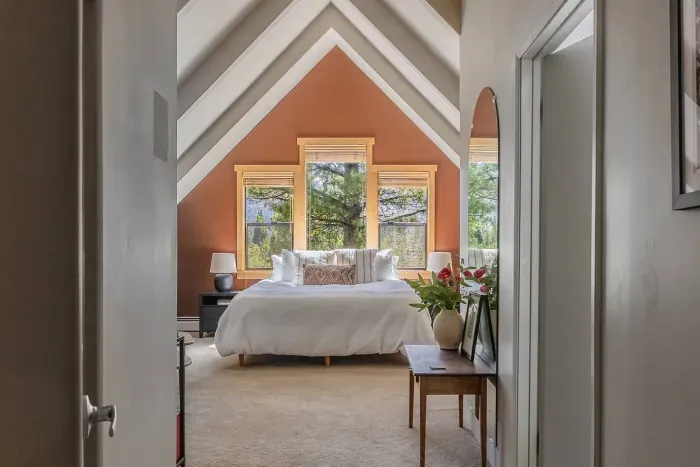 Entrance to the primary suite, which is just a few steps away from the flexible/kids room upstairs. There is a walk-in closet to the left and the ensuite bath to the right. This room is spacious! 