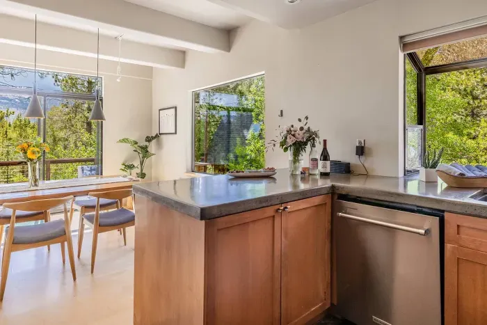 Our kitchen has the perfect setup for entertaining with easy flow to both the dining room and the living room. We offer plenty of small appliances and kitchenwares. Its also equipped with a dishwasher, large refrigerator and gas range. 