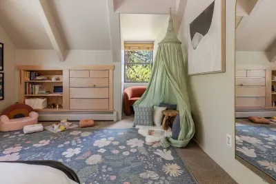 Kids love the setup here with picnic supplies, wooden forest friends, and the perfect place to read a book.