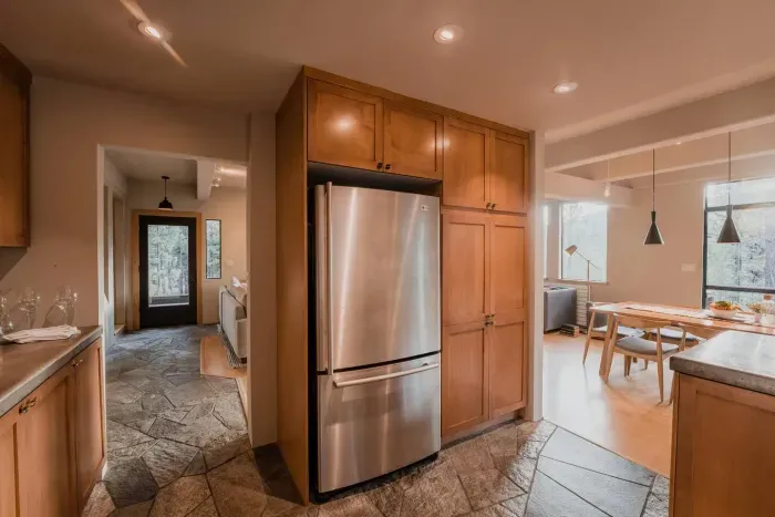 Large stainless steel fridge and plenty of kitchen storage!