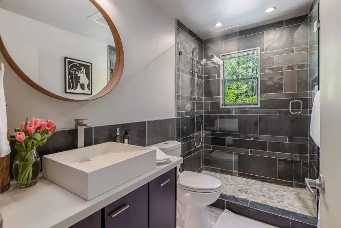 The downstairs full bathroom right across the hall from the downstairs King bedroom.