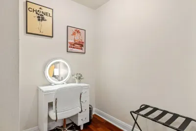 Lovely bedroom setup with a cute vanity and mirror.
