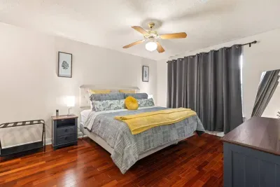 Spacious master bedroom # 2 featuring a king Sleep Number bed and cozy decor.