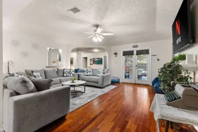 Spacious living room with cozy seating for everyone.