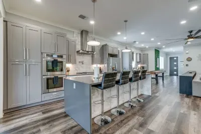 Gourmet kitchen, fully equipped with top-of-the-line appliances and ample counter space