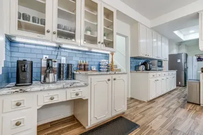 Coffee Bar!! Fully Stocked. Offering A Traditional Brewer, Instant Dual Pot Espresso And K-Cup Coffee Machine, Coffee Grinder And Electric Tea Kettle. We Always Have It Stocked With Plenty Of K-Cups, Espresso Pods, Tea, Coffee Beans, Creamers And A V