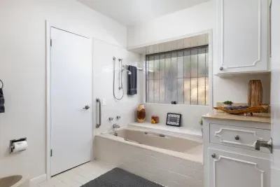 Full bath number 1 that is private to bedroom 1.  Full shower (not pictured), bathtub, bidet and double sinks. Very large space!