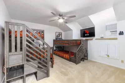 One full size bed and three twins. The bottom bunk on the left features the full size mattress. All beds feature premium mattresses! 