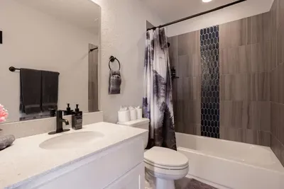 Upstairs second master bathroom.