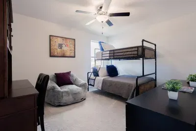 Room with full-size bottom bunk and twin top. Located upstairs.