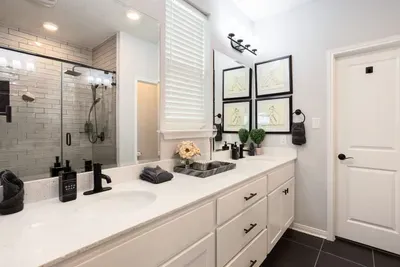 Plenty of storage and fresh towels in the master bathroom.