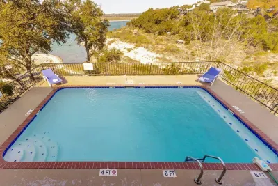 The pool offers stunning views of the lake, creating a serene and picturesque backdrop for your relaxation.