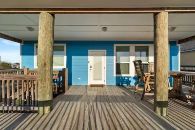 Spacious covered deck with plenty of room to spread out, dine outdoors, and enjoy the coastal breeze.