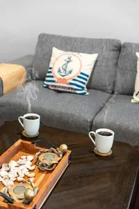 Start your morning slow with a fresh cup of coffee in the cozy living room—kick back on the sectional and ease into beach mode.