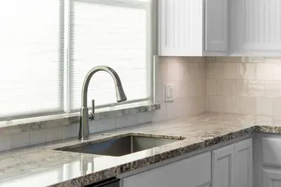 Bright, spacious kitchen with plenty of counter space and a large sink for easy meals and cleanup.