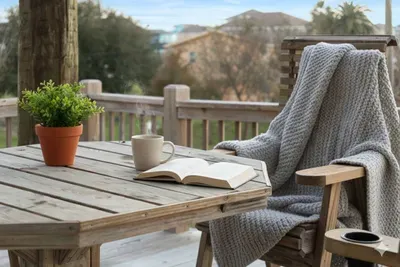 Unwind on the deck with comfy seating and a table that’s perfect for coffee, reading, or relaxing in the coastal breeze.