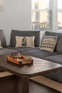 Stretch out on the spacious sectional and relax in a bright, comfortable living area—perfect for movie nights, board games, or winding down after a day at the beach.