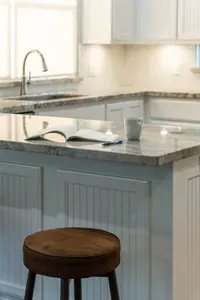 Spacious granite island with bar seating—great for morning coffee, planning your beach day, or gathering for snacks and conversation.