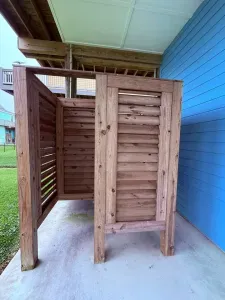 Custom-built cedar outdoor shower located just off the home, designed for both privacy and style. Easy access, spacious layout, and ideal for rinsing off sand before heading inside.