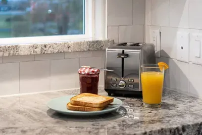 Start your morning right with toast, coffee, and an easy breakfast setup in the kitchen.