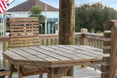 Relax on the deck with comfortable seating and a table for outdoor meals, morning coffee, or sunset drinks.