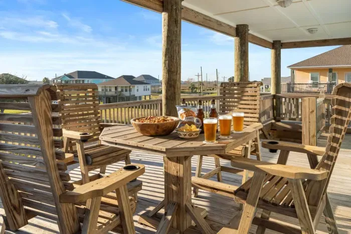 Unwind on the spacious covered deck with plenty of seating for the whole group. It’s the perfect spot for morning coffee, afternoon snacks, or a laid-back evening drink while you take in the coastal breeze and neighborhood views.