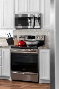 Fully equipped kitchen with stainless steel appliances and everything you need to cook, reheat, and serve meals with ease.