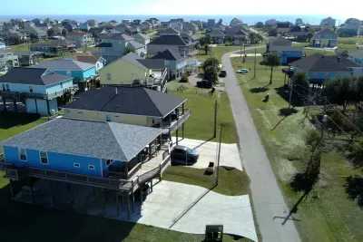 Quiet coastal street with easy beach access and plenty of space to park.